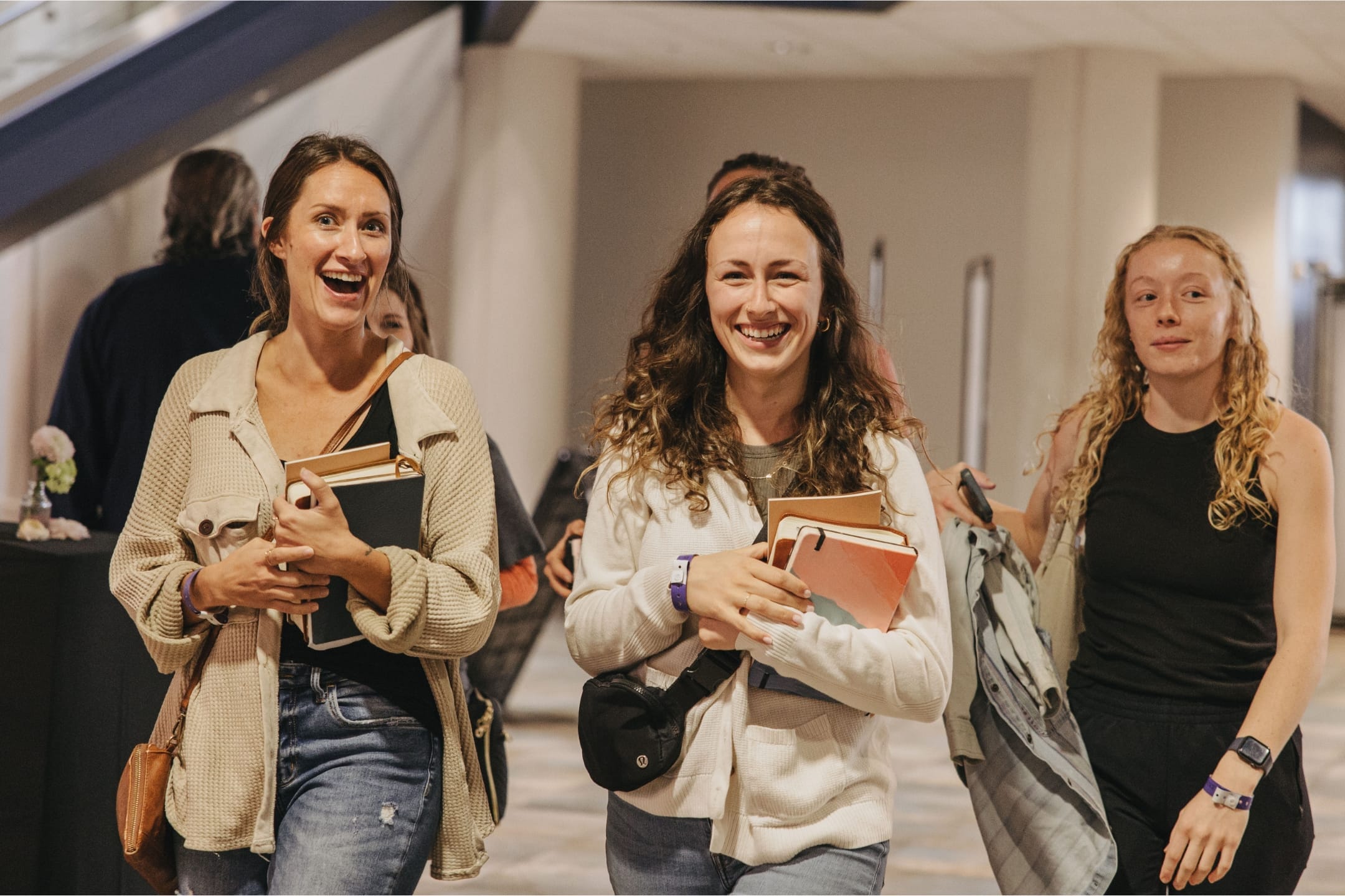 Women's Conference attendees walking and smiling.