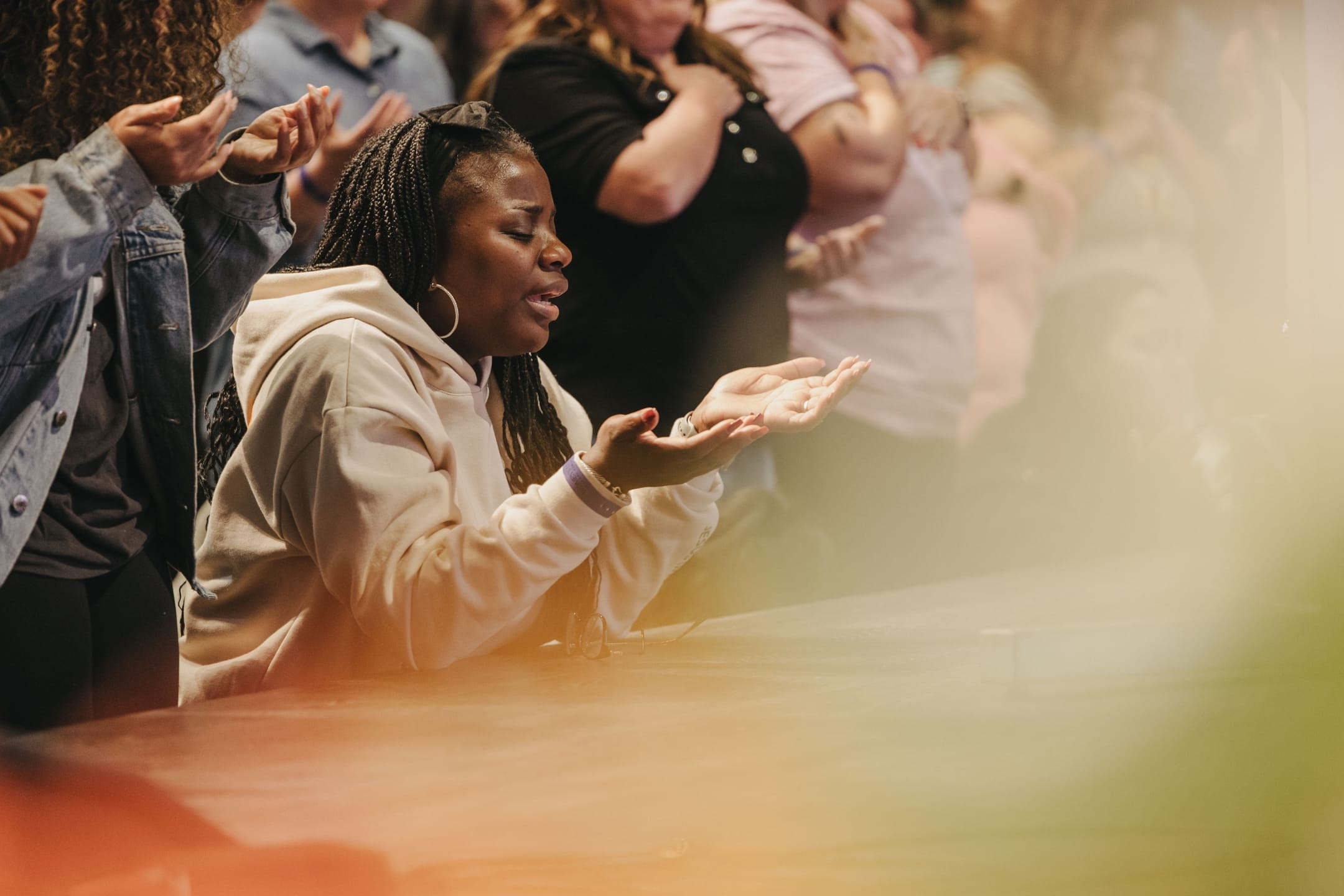 Woman worshiping with palms up