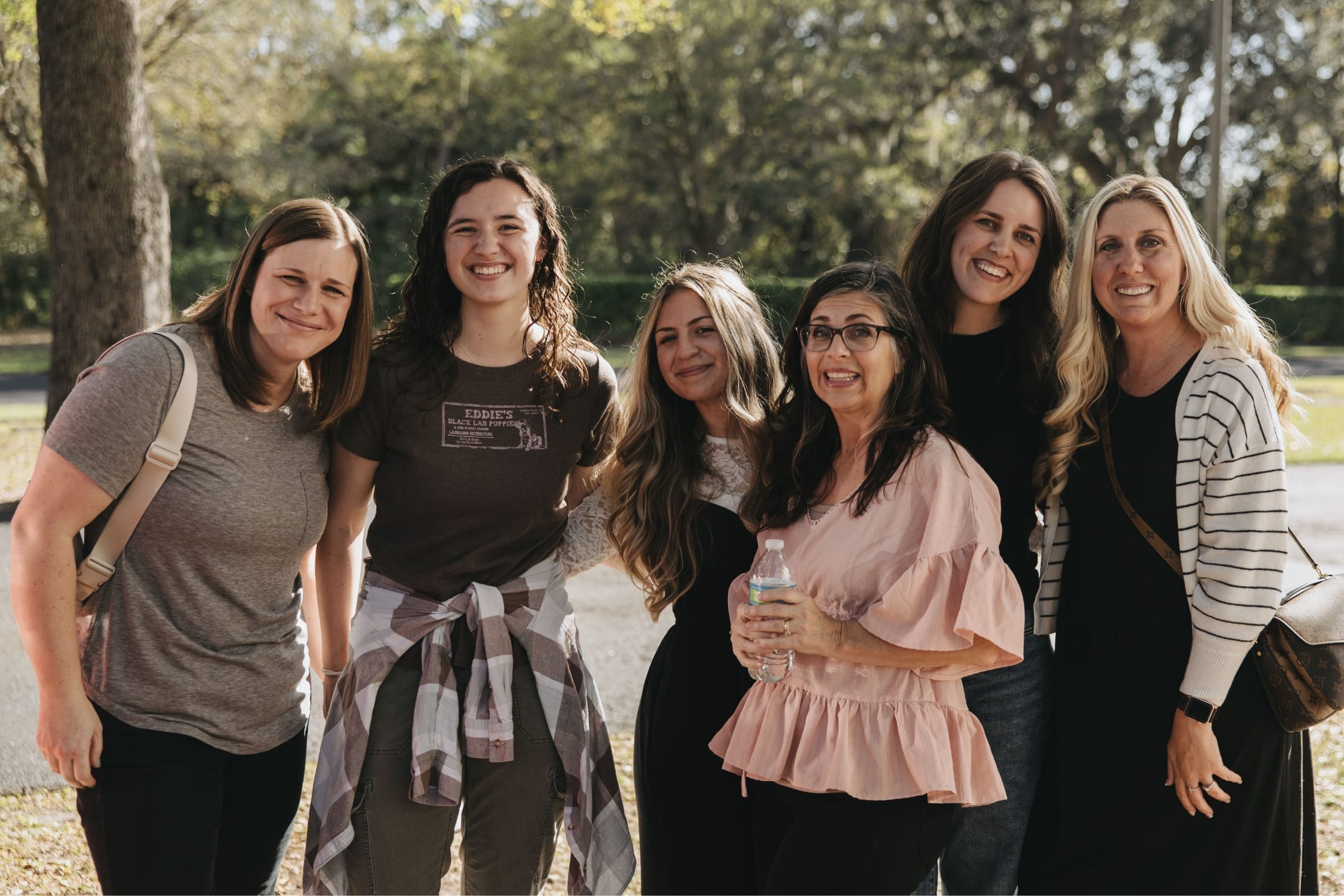Group of attendees outdoors smiling